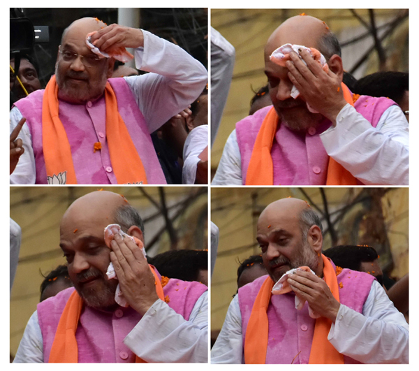 Photo : अमित शाह के रोडशो में हिंसा, कई घायल Photo : अमित शाह के रोडशो में हिंसा, कई घायल